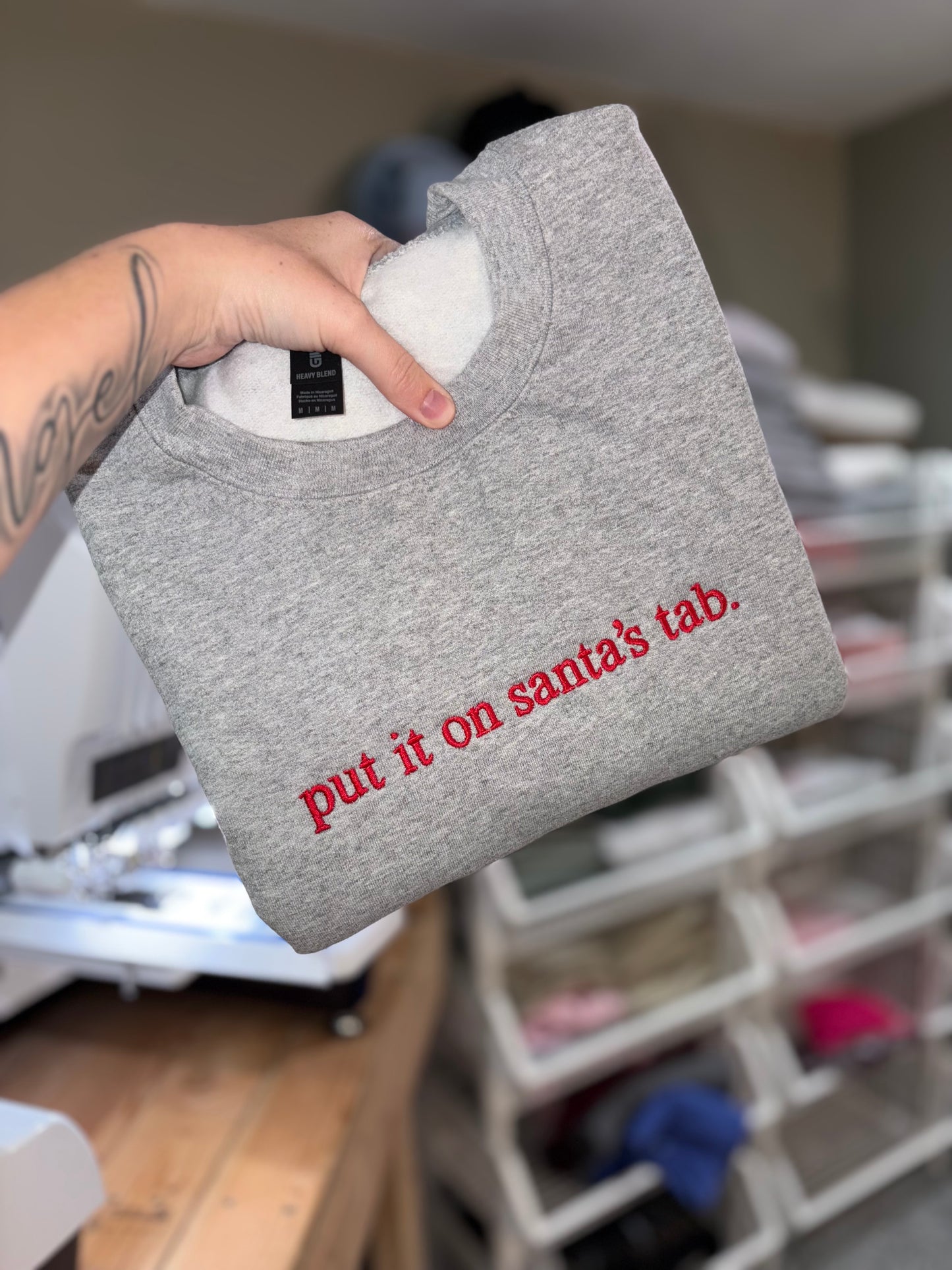 Put it on Santa’s tab embroidered crew